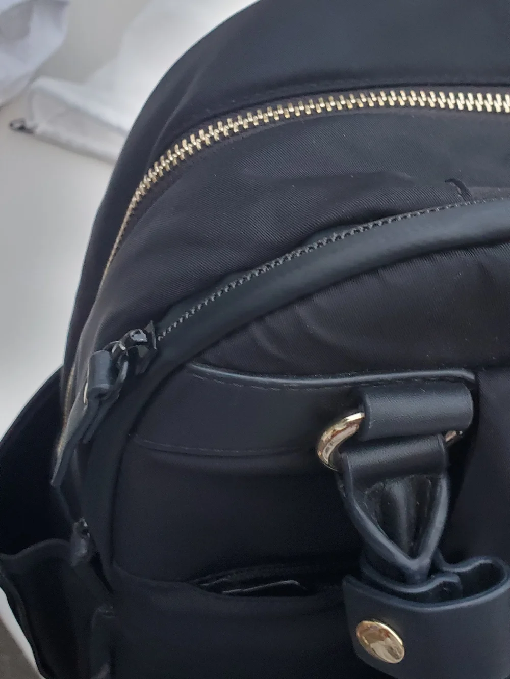Lo & Sons Black Backpack with Gold Zipper Accents